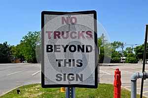 No Trucks Beyond This Sign Signage