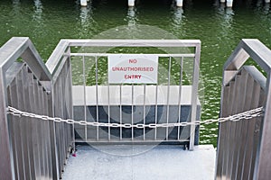 No unauthorised entry sign on the gate with chain