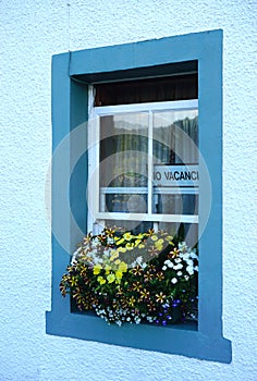 No vacancy sign in the window of a rural Scottish inn