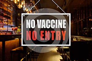 No Vaccine No Entry Sign at a bar, tavern or pub. Proof or vaccination required to enter a shop or business establishment