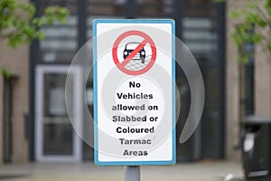 No vehicles allowed on slabbed or coloured tarmac area sign