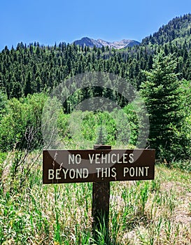 No vehicles beyond this point. Sign marking the end of the road.