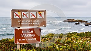 `No vehicles, dogs, camping or fires` sign