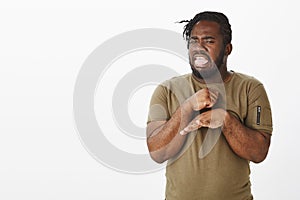 No way. Portrait of disgusted funny african-american guy in casual outfit, sticking out tongue and making never or