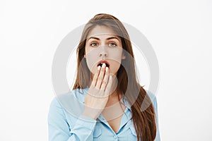 No way, unbelievable rumor. Portrait of girl pretending to be shocked while hearing gossip or eavesdropping conversation