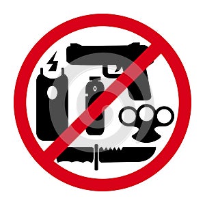 No weapons sign on red round with symbols of knife, gun, electric shocker and gas spray. Please do not enter with any weapon photo