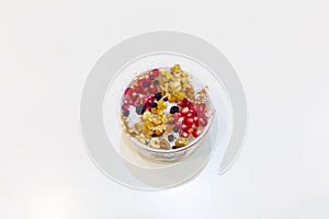 Noah`s pudding in white bowl. The dried fruits, legumes and cereals are made with wheat and sugar. It is decorated with walnut, dr