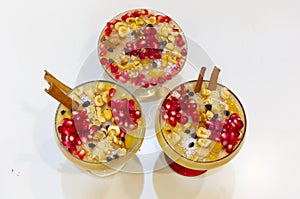 Noah`s pudding in white bowl. The dried fruits, legumes and cereals are made with wheat and sugar. It is decorated with walnut, dr