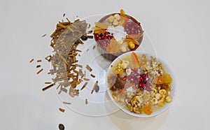 Noah`s pudding in white bowl. The dried fruits, legumes and cereals are made with wheat and sugar. It is decorated with walnut, dr