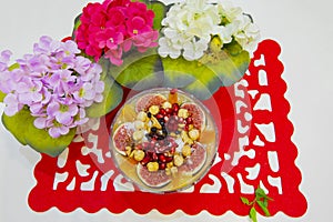 Noah`s pudding in white bowl. The dried fruits, legumes and cereals are made with wheat and sugar. It is decorated with walnut, dr