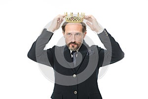 Nobility obliges. Business king. Mature businessman wearing crown. Senior man representing power and triumph. Success in