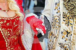 Noble Lovers Holding Hands in Ancient and Luxurious Aristocratic Clothes during Masquerade Ball