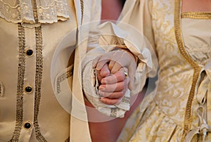 Noble Lovers Holding Hands in Luxurious Aristocratic Clothes during Masquerade Ball