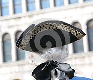 Noble man with wig and hat in the Piazza San Marco in Venice dur