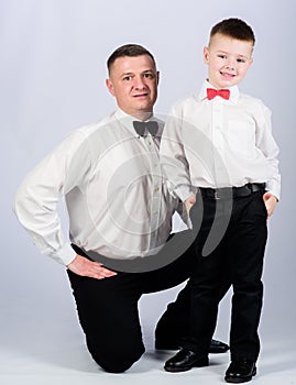 Nobleman. little boy with dad businessman. family day. tuxedo style. happy child with father. business meeting party