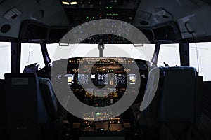 Nobody in empty captain cabin used to fly airplane with dashboard