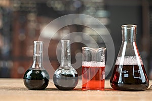 Nobody, laboratory experiments with different sizes flasks with liquids