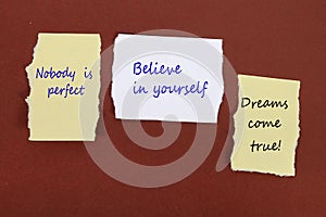 Nobody is perfect. Believe in yourself. Dreams come true! Note pin on the bulletin board