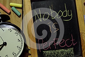 Nobody is Perfect on phrase colorful handwritten on chalkboard