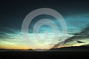 Noctilucent clouds on blue esky photo