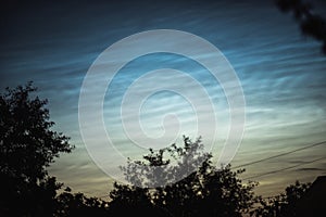 Noctilucent clouds on a summer evening in a Ukrainian village