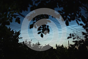 Noctilucent clouds on a summer evening in a Ukrainian village