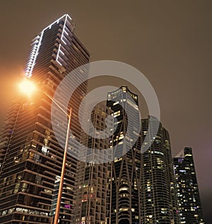 Nocturnal architecture. Skyscrapers lit up in Miami, USA. Illuminated architecture. Night city