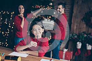 Noel evening concept. Photo of cheerful people cute girl schoolgirl mom dad wearing red pullovers pondering desiring