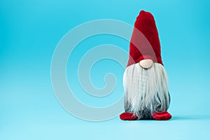 Noel gnomes elfes on blue background. Christmas greating card. Christmas or New Year celebration concept. Copy space