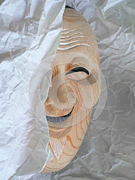 The noh mask was covered by the paper half-face off