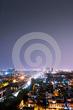 Noida cityscape at night with houses, skyscrapers and streets