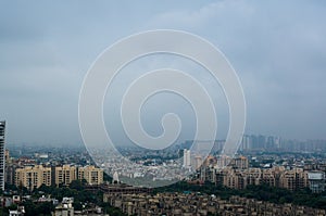 Noida Skyscraper under construction with smaller buildings aroun