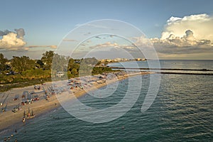 Nokomis beach with soft white sand in Sarasota county, USA. Many people enjoing vacation time bathing in warm gulf water photo