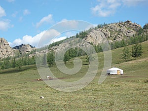 A nomadic family in the silent meadow, Terelj valley, Tuv province, Mongolia.