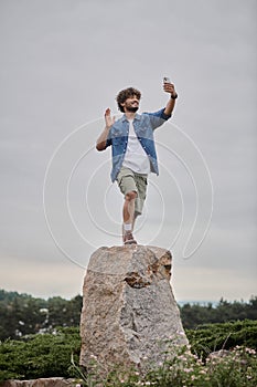 nomadism concept, curly indian man standing