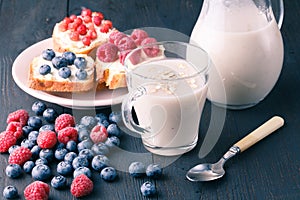 Non-dairy vegan oat milk with berries, healthy diet