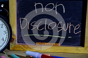 Non disclosure management on phrase colorful handwritten on blackboard