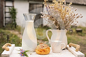 non-homogenized Homemade milk on a vintage tray against the backdrop