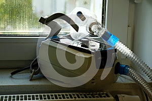 non invasive ventilator with mask used by patients with respiratory problems at home