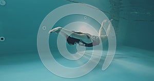 Non-professional woman swimmer, dolphin technique