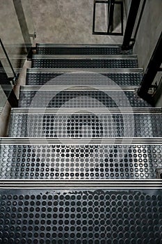 Non-slip stairs with dot pattern close up for background.