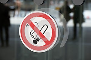 Non-smoking sign on a glass wall as a sign of prohibition