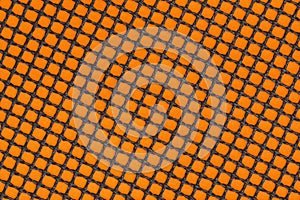 Non-stick fibreglass grill mat arranged in a diagonal position on the orange background photo