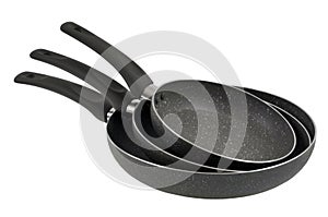 Non-stick pans stacked on white background