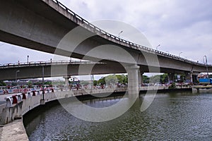 Non-stop speedway Kuril Flyover with cloudy sky and lake in Dhaka Bangladesh