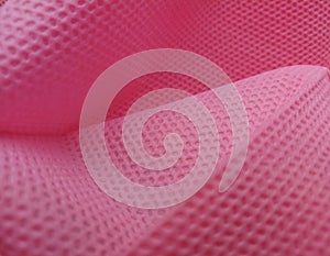 Non-woven fabric with holes in the fiber and pores of the texture of the pink prophylene fabric