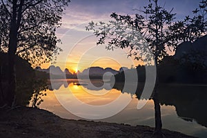 Nong Thale lake and limestone mountain at sunrise, Krabi