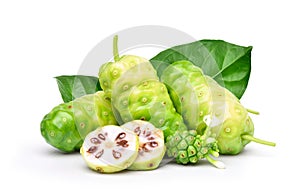 Noni or Morinda Citrifolia fruits with sliced and green leaf