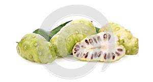 Noni or Morinda Citrifolia fruits with sliced and green leaf isolated on white background