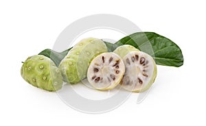 Noni or Morinda Citrifolia fruits with sliced and green leaf isolated on white background